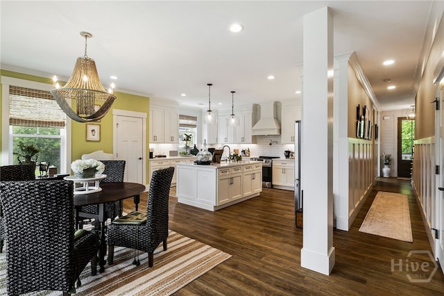 122 N St, Savannah, GA 31410 - dining space featuring crown molding, healthy amount of natural light, a chandelier, dark wood finished floors, and recessed lighting