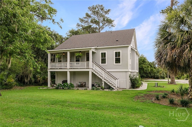 122 N St, Savannah, GA 31410 - back of house with stairway, a yard, ceiling fan, and roof with shingles