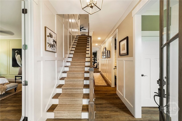 122 N St, Savannah, GA 31410 - stairs featuring a decorative wall and wood finished floors
