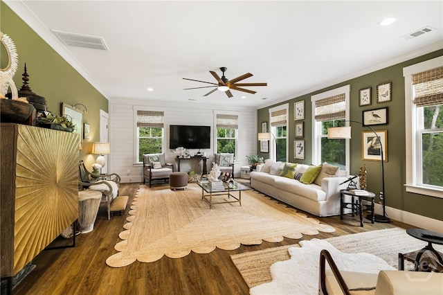 122 N St, Savannah, GA 31410 - living area featuring crown molding, dark wood finished floors, a ceiling fan, plenty of natural light, and recessed lighting