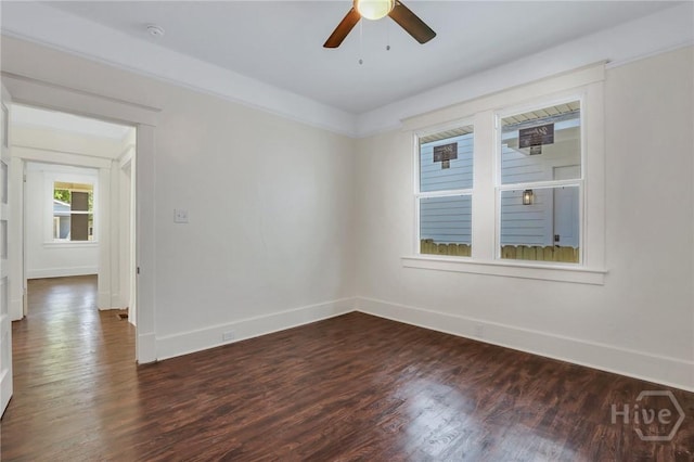 521 Seiler Ave, Savannah, GA 31401 - empty room with baseboards, dark wood-style floors, a ceiling fan, and a smoke detector