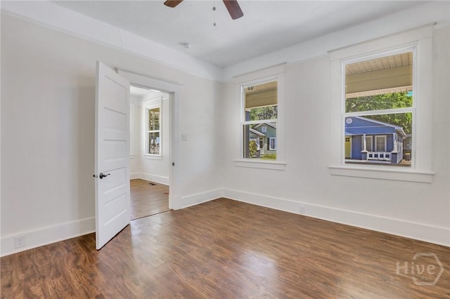 521 Seiler Ave, Savannah, GA 31401 - unfurnished room featuring ceiling fan, baseboards, dark wood-style flooring, and a smoke detector