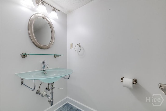 1 Shipyard Ln, Savannah, GA 31406 - bathroom featuring baseboards and a textured ceiling
