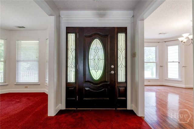 1 Shipyard Ln, Savannah, GA 31406 - entryway with baseboards, dark carpet, and a chandelier