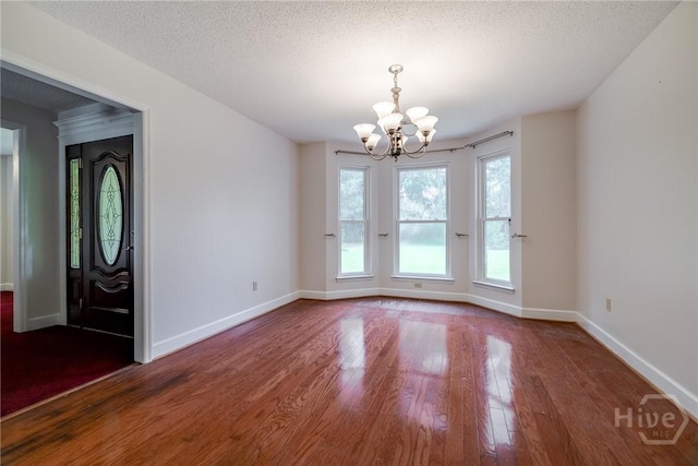 1 Shipyard Ln, Savannah, GA 31406 - unfurnished dining area with a chandelier, wood finished floors, baseboards, and a textured ceiling