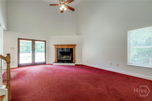 1 Shipyard Ln, Savannah, GA 31406 - unfurnished living room with high vaulted ceiling, dark carpet, a ceiling fan, french doors, and baseboards