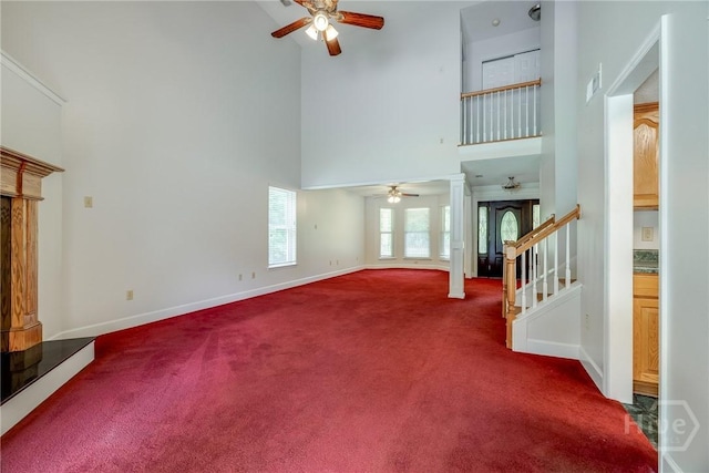 1 Shipyard Ln, Savannah, GA 31406 - unfurnished living room featuring ceiling fan, a high ceiling, carpet, and baseboards
