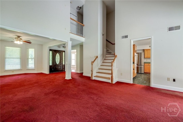1 Shipyard Ln, Savannah, GA 31406 - unfurnished living room with a high ceiling, carpet, baseboards, ceiling fan, and ornate columns