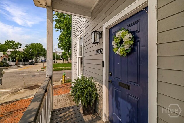 1402 Jefferson St, Savannah, GA 31401 - property entrance with a porch