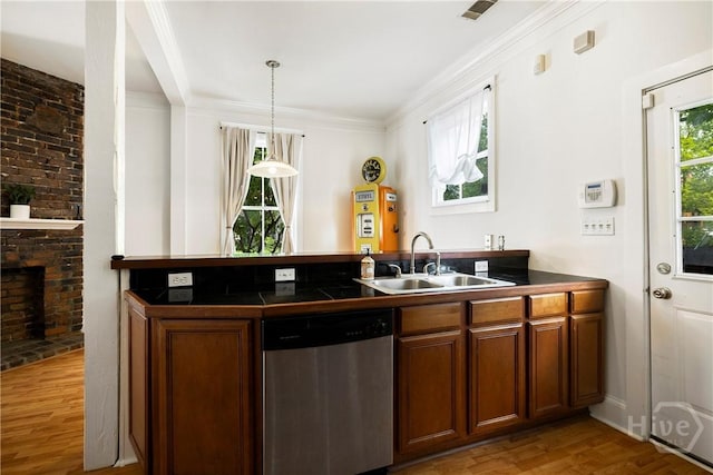 1402 Jefferson St, Savannah, GA 31401 - kitchen featuring dishwasher, a sink, light wood-style flooring, brown cabinets, and a peninsula