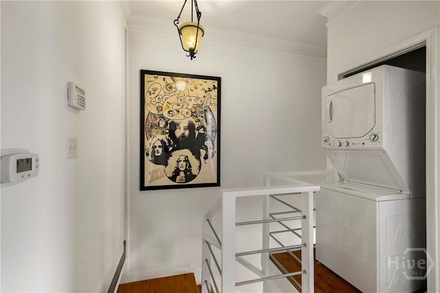 1402 Jefferson St, Savannah, GA 31401 - washroom with stacked washer / drying machine, crown molding, dark wood-type flooring, and baseboards