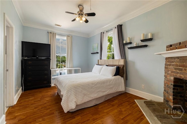 1402 Jefferson St, Savannah, GA 31401 - bedroom featuring wood finished floors, baseboards, ornamental molding, a fireplace, and ceiling fan