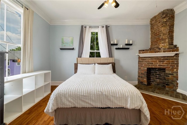 1402 Jefferson St, Savannah, GA 31401 - bedroom with ornamental molding, wood finished floors, baseboards, and ceiling fan