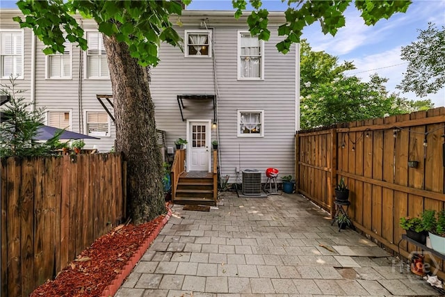 1402 Jefferson St, Savannah, GA 31401 - back of house featuring a fenced backyard, a patio area, and central AC unit