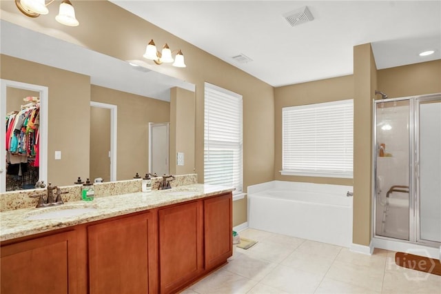 133 Moonlight Trl, Port Wentworth, GA 31407 - bathroom with a shower stall, a garden tub, double vanity, tile patterned floors, and a spacious closet