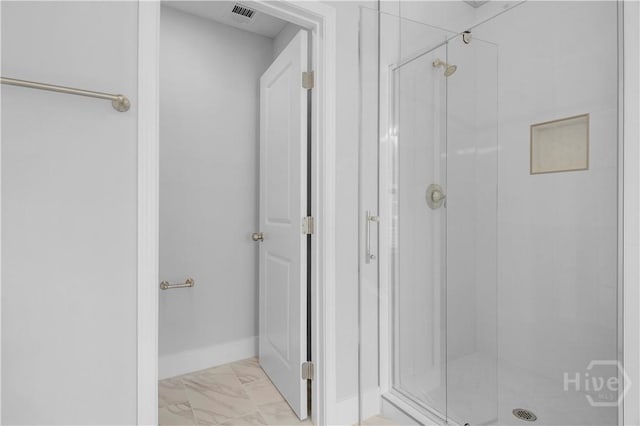 220 N Skinner Ave, Pooler, GA 31322 - bathroom with marble finish flooring, a stall shower, and baseboards