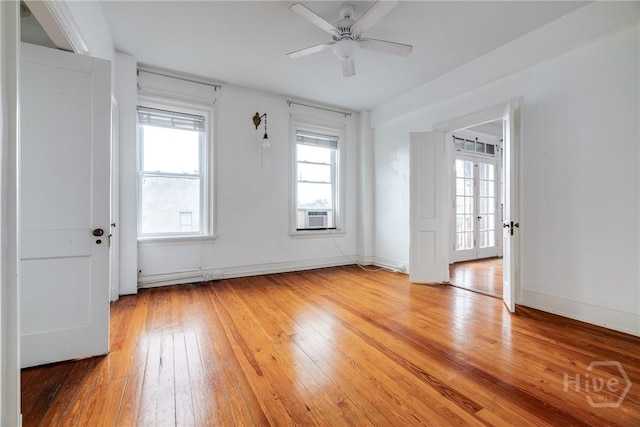 24 E Liberty St Unit 44, Savannah, GA 31401 - empty room featuring light wood-style flooring, a ceiling fan, and cooling unit