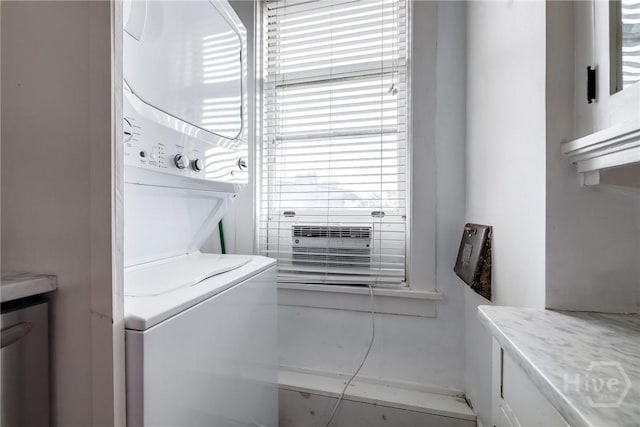 24 E Liberty St Unit 44, Savannah, GA 31401 - laundry room with estacked washer and dryer and cabinet space