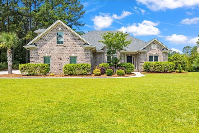 760 Southbridge Blvd, Savannah, GA 31405 - traditional-style home with brick siding, a front lawn, and roof with shingles