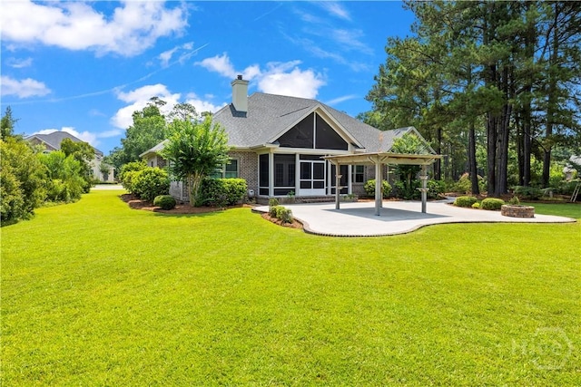760 Southbridge Blvd, Savannah, GA 31405 - back of house featuring a fire pit, a patio area, a sunroom, and a lawn