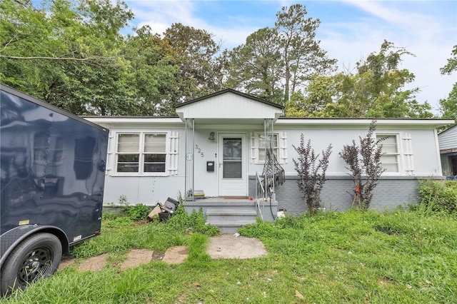325 Bunting Dr, Savannah, GA 31404 - view of front of house with brick siding and stucco siding