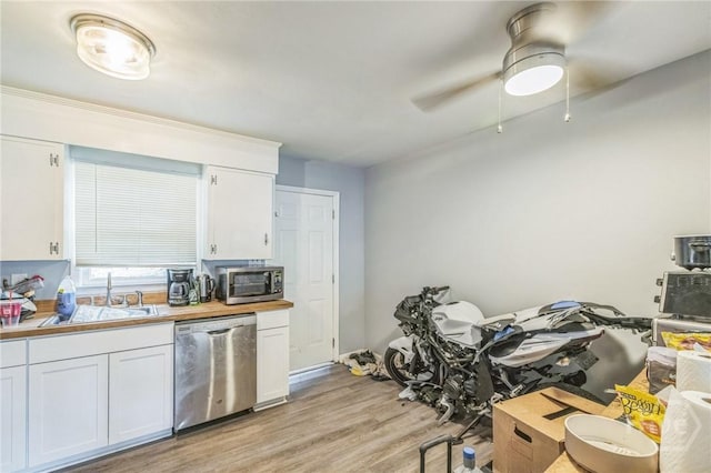 325 Bunting Dr, Savannah, GA 31404 - kitchen with appliances with stainless steel finishes, white cabinets, light wood-style flooring, a ceiling fan, and light countertops