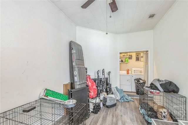 325 Bunting Dr, Savannah, GA 31404 - misc room with washing machine and clothes dryer, wood finished floors, and a ceiling fan