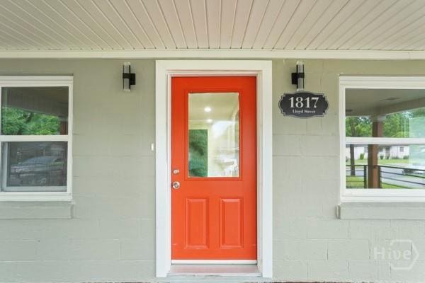 1817 Lloyd St, Savannah, GA 31405 - doorway to property with concrete block siding and a porch