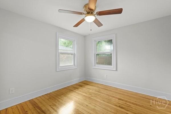 1817 Lloyd St, Savannah, GA 31405 - empty room with light wood finished floors and a ceiling fan