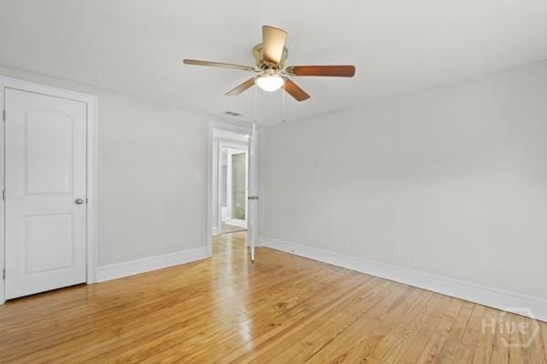 1817 Lloyd St, Savannah, GA 31405 - empty room with light wood-style flooring and a ceiling fan