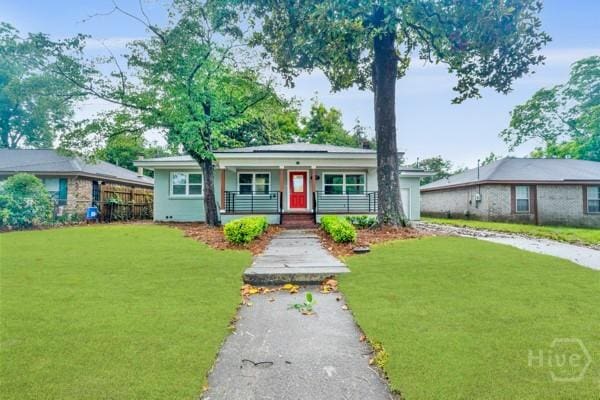 1817 Lloyd St, Savannah, GA 31405 - ranch-style home featuring covered porch and a front yard