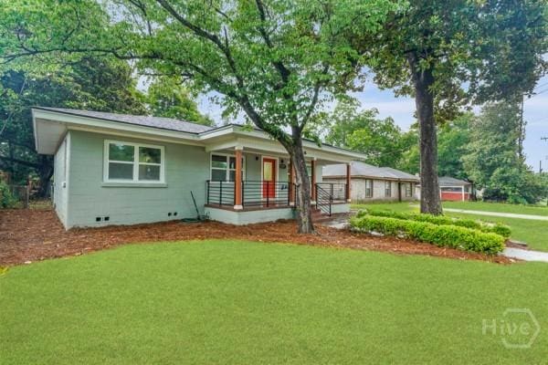 1817 Lloyd St, Savannah, GA 31405 - ranch-style home featuring a porch and a front lawn