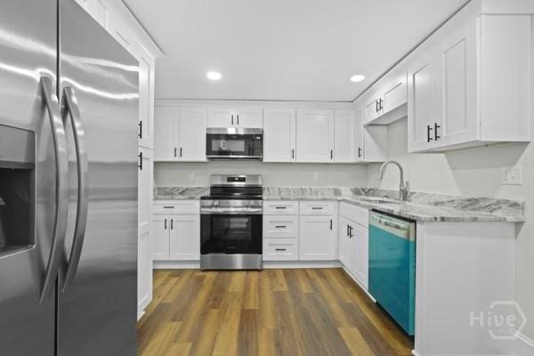 1817 Lloyd St, Savannah, GA 31405 - kitchen with appliances with stainless steel finishes, white cabinetry, and recessed lighting