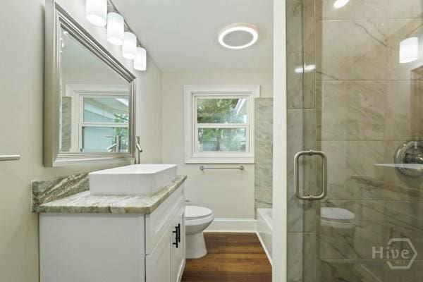 1817 Lloyd St, Savannah, GA 31405 - full bathroom featuring vanity, a shower with door, and wood finished floors