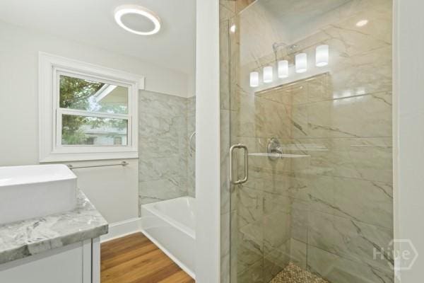 1817 Lloyd St, Savannah, GA 31405 - bathroom featuring vanity, a stall shower, wood finished floors, and a bath