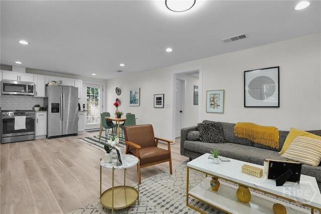 1220 E 69th St, Savannah, GA 31404 - living room featuring light wood-style flooring and recessed lighting