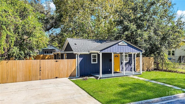 1220 E 69th St, Savannah, GA 31404 - bungalow-style house with board and batten siding and a porch