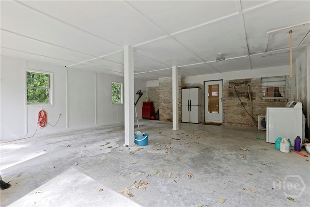 2317 Ga Highway 24, Statesboro, GA 30461 - below grade area with washer / dryer, healthy amount of natural light, and freestanding refrigerator