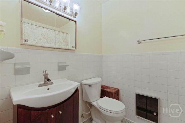 2317 Ga Highway 24, Statesboro, GA 30461 - full bath featuring tile walls, vanity, toilet, wainscoting, and heating unit