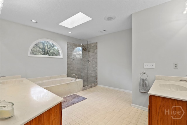 550 Strathy Hall Dr, Richmond Hill, GA 31324 - full bath featuring double vanity, a skylight, a garden tub, a stall shower, and recessed lighting