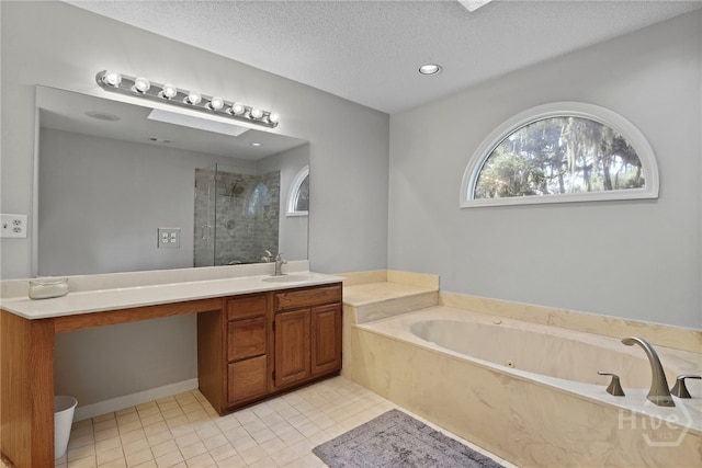550 Strathy Hall Dr, Richmond Hill, GA 31324 - full bathroom featuring a shower stall, vanity, a bath, tile patterned floors, and a textured ceiling