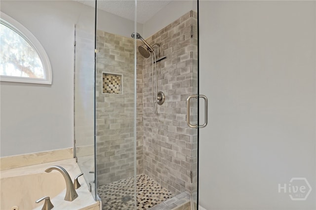 550 Strathy Hall Dr, Richmond Hill, GA 31324 - full bathroom with a shower stall, a whirlpool tub, and a textured ceiling