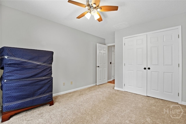 550 Strathy Hall Dr, Richmond Hill, GA 31324 - unfurnished bedroom featuring carpet, baseboards, a closet, and ceiling fan