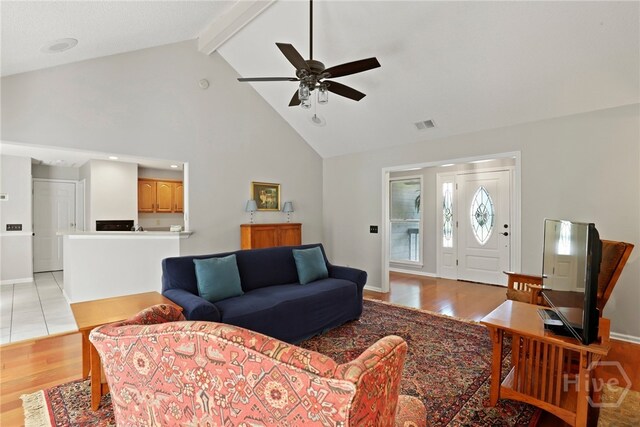 550 Strathy Hall Dr, Richmond Hill, GA 31324 - living area with high vaulted ceiling, a ceiling fan, light wood finished floors, beam ceiling, and baseboards