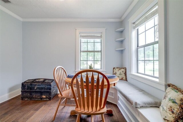 149 Spruce St, Richmond Hill, GA 31324 - dining area featuring hardwood / wood-style flooring, healthy amount of natural light, crown molding, and baseboards