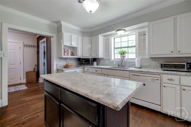 149 Spruce St, Richmond Hill, GA 31324 - kitchen with dishwasher, a sink, stainless steel microwave, dark wood-style floors, and ornamental molding