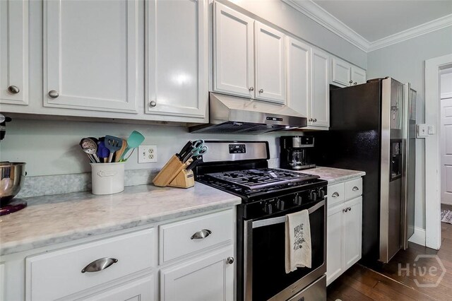 149 Spruce St, Richmond Hill, GA 31324 - kitchen featuring appliances with stainless steel finishes, under cabinet range hood, ornamental molding, white cabinetry, and dark wood-style flooring