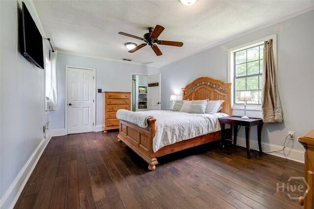 149 Spruce St, Richmond Hill, GA 31324 - bedroom with baseboards, dark wood-style flooring, crown molding, and a ceiling fan