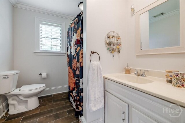 149 Spruce St, Richmond Hill, GA 31324 - full bathroom with vanity, toilet, wood tiled floors, baseboards, and ornamental molding