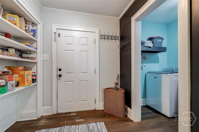 149 Spruce St, Richmond Hill, GA 31324 - entrance foyer featuring washer / dryer, ornamental molding, dark wood-type flooring, and baseboards